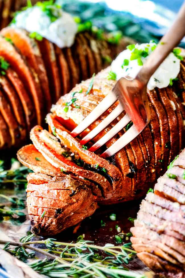These Hasselback Sweet Potatoes are tender, melt-in-your-mouth and bursting with garlic herb, butter flavor!ย They look wonderfully gourmet for holidays and special occasions but are everyday easy!ย