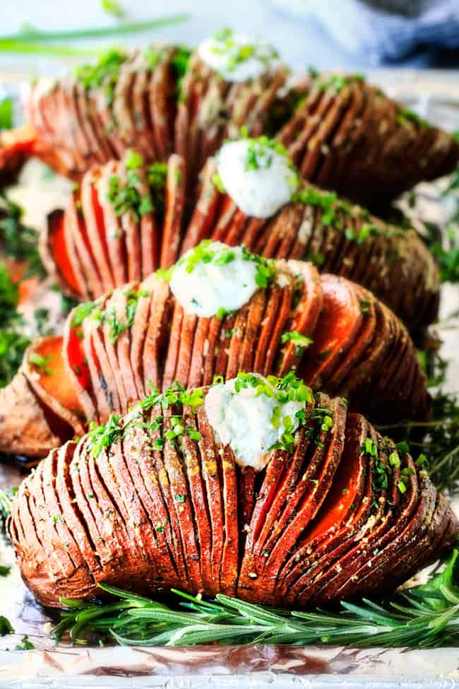 These Hasselback Sweet Potatoes are tender, melt-in-your-mouth and bursting with garlic herb, butter flavor!ย They look wonderfully gourmet for holidays and special occasions but are everyday easy!ย