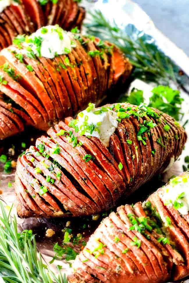 These Hasselback Sweet Potatoes are tender, melt-in-your-mouth and bursting with garlic herb, butter flavor!ย They look wonderfully gourmet for holidays and special occasions but are everyday easy!ย