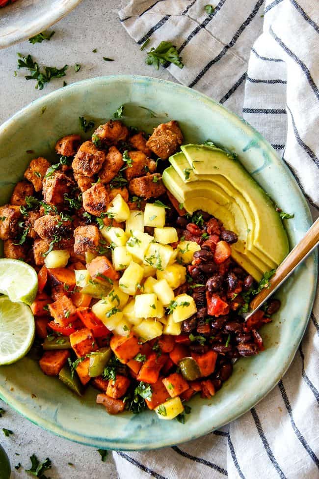 30 Minute Cajun Chicken Bowls bursting with avocados, black beans, sweet potatoes and pineapple!ย These are spicy, fresh, healthy and ADDICTING!ย ย