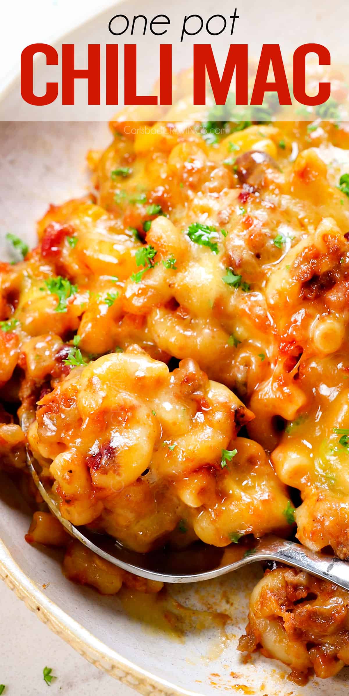 up close of a spoonful of chili mac showing how cheesy it is