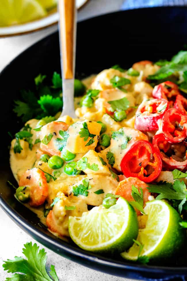 This EASY Thai Yellow Curry with Chicken tastes straight out of a restaurant!ย Its wonderfully thick and creamy, bursting with flavor and veggies (I highly recommend the listed potatoes, cauliflower and peas) and all made in one pot! Definitely a hit at our house!