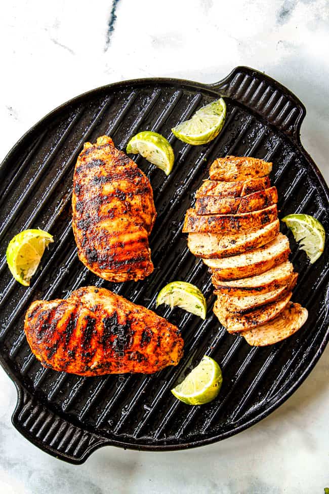 top view of showing how to cook chili lime chicken with three chicken breasts with grill marks on an indoor griill pan