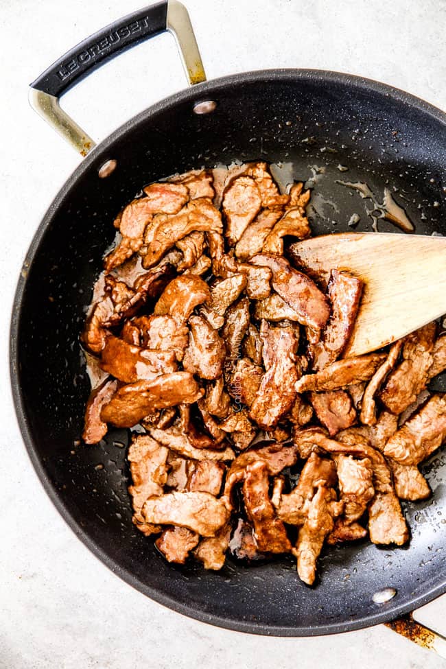 tender beef in skillet being cooked for Broccoli Beef