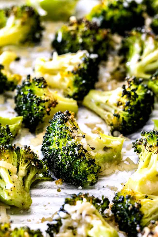 QUICK AND EASY this Parmesan Roasted Broccoli is bursting with flavor, caramelized crispy tops and the quickest side dish to everyย meal all made in ONE PAN!ย AKA Minimal effort, HUGE flavor! showing how to make oven roasted broccoli by spreading broccoli in an even layer on a baking sheet