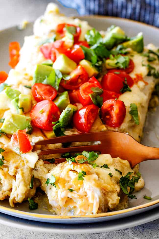 Taking a bite of Green Chile Chicken Enchiladas.