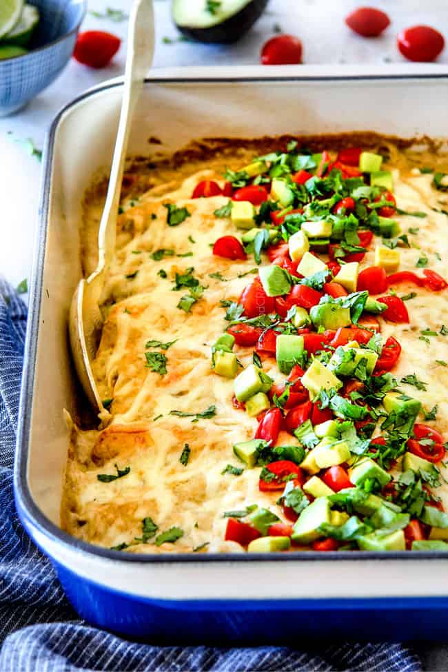 Green Chile Chicken Enchiladas with tomatoes and cilantro.