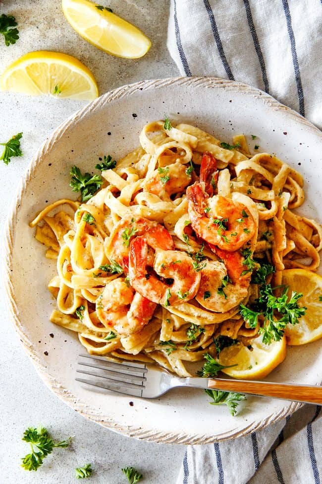 20 MINUTE Lemon Garlic Shrimp Fettuccine is wonderfully creamy, bursting with flavor and so easy! The most gourmet tasting dinner you can make in under 30 minutes!