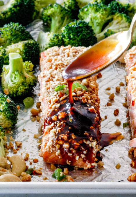 Drizzling honey soy glaze on Cashew Crusted Honey Soy Salmon
