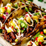 Up Close of Pulled Pork Taco made in the slow cooker on a cutting board