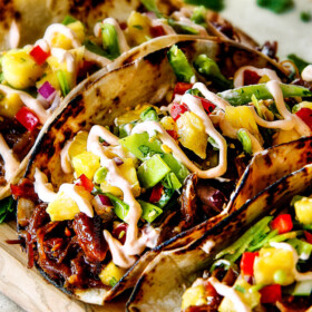 Up Close of Pulled Pork Taco made in the slow cooker on a cutting board