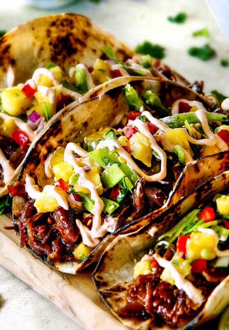 Up Close of Pulled Pork Taco made in the slow cooker on a cutting board