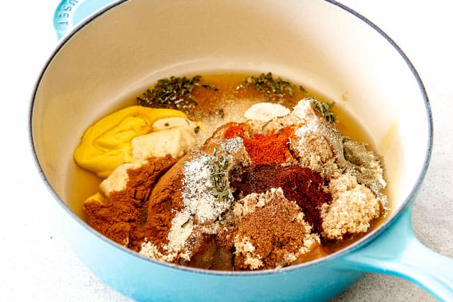 Showing how to make Brown Sugar Glaze for Ham by adding brown sugar and honey, cinnamon, nutmeg, cloves, garlic, onion powder, paprika, sage to a small saucepan