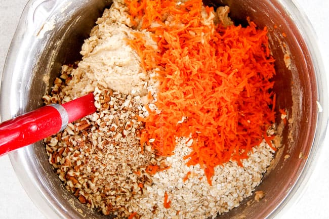 Showing How to make Carrot Cake Cookies by mixing carrots, oatmeal, cinnamon and all wet and dry ingredients together