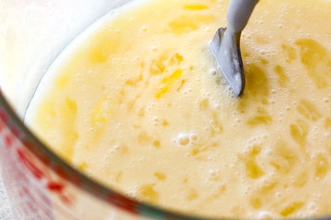 How to make easy moist Coconut Cake by whisking egg whites and cream of coconut in a measuring cup