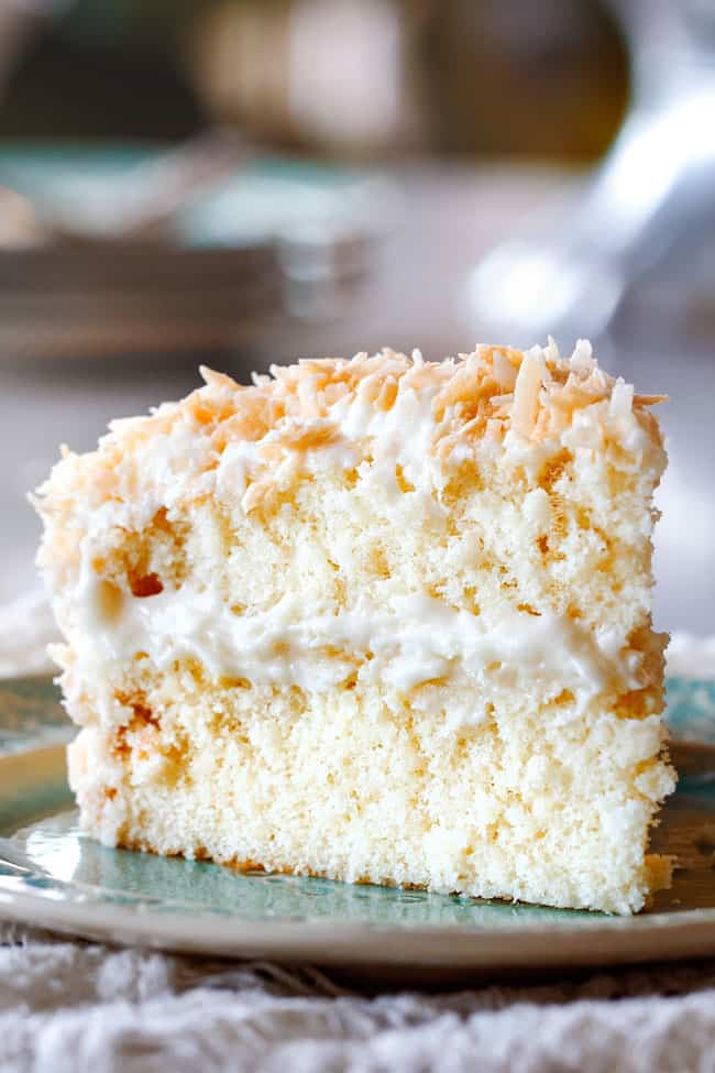 Best Coconut Cake on silver plate with a fork
