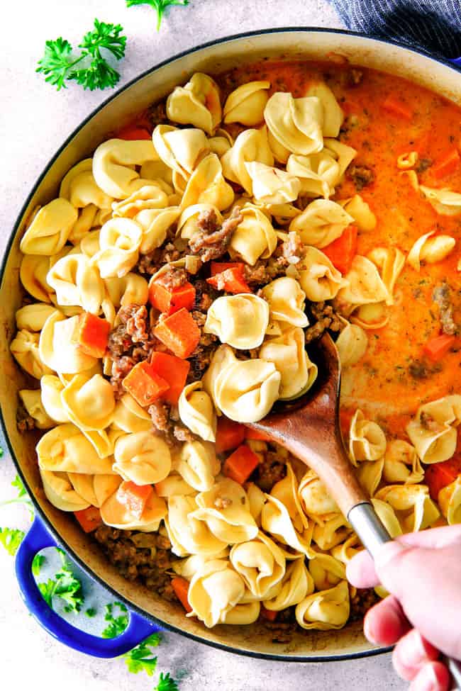 How to Make Creamy Tortellini by adding tortellini to skillet and starting to simmer
