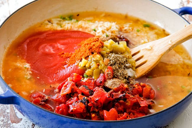 Showing how to make authentic Mexican Rice by Adding tomato sauce, fire roasted tomatoes, green cihles, chicken broth, ground cumin, peas, carrots, corn to rice