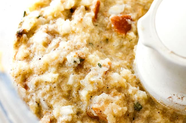 Showing how to make Swedish Meatballs by mixing bread, eggs, heavy cream, onions, nutmeg, allspice in food processor