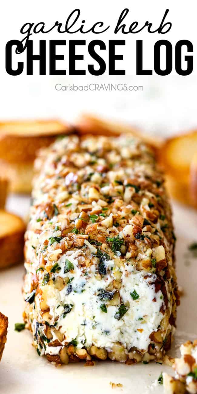 front shot of goat cheese log with garlic, zemon zest, basil, chives, parsley and rolled in pecans
