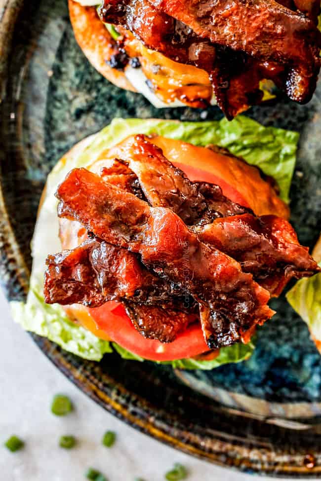 open faced bacon cheeseburger with lettuce and tomatoes