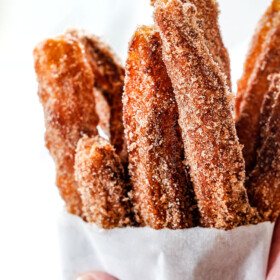 easy churros in a white bag standing straight up