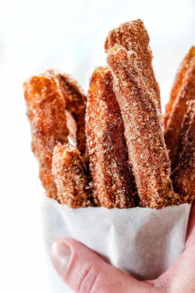 easy churros in a white bag standing straight up