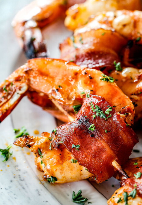 up close of best bacon wrapped shrimp with homemade cocktail sauce