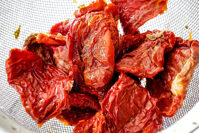 showing how to make Sun-Dried Tomato Pasta by rinsing sun-dried tomatoes