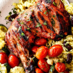 top view of authentic tandoori Chicken with Indian rice and roasted tomatoes