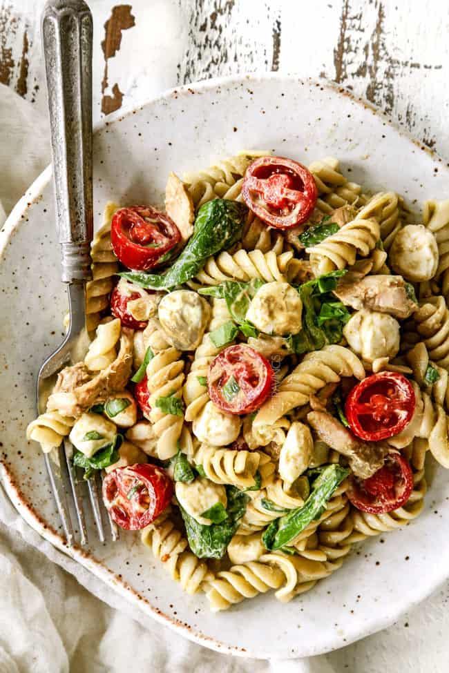 top view of a plate of caprese pasta salad with balsamic chicken