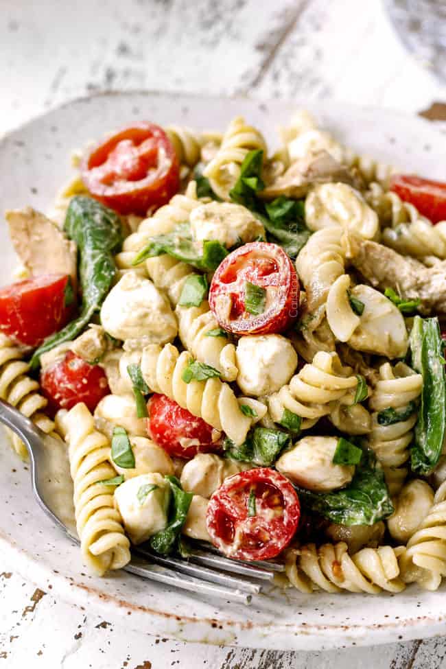 top view of a plate of caprese pasta salad with balsamic chicken