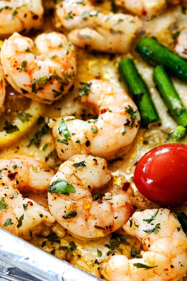 up close of baked shrimp scampi on a baking sheet