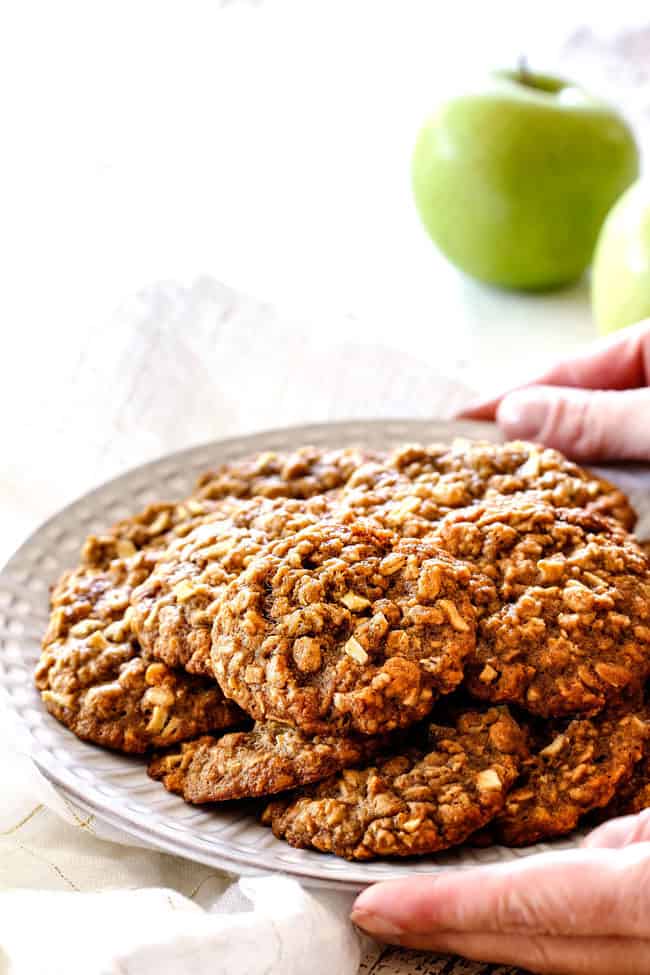 side view of plate of easy apple cookies with oatmeal on a white plate
