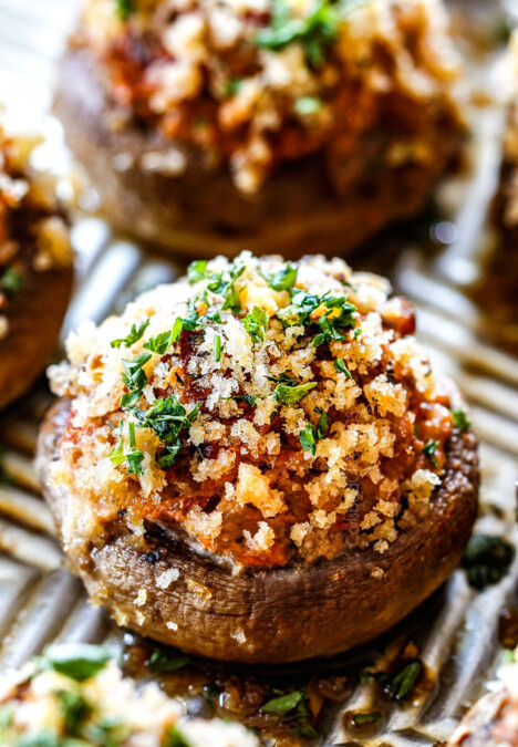 side view of best sausage stuffed mushrooms on a baking sheet with cream cheese filling and panko topping
