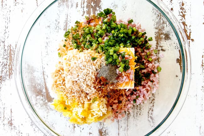 showing how to make Pineapple Cheese Ball by adding cream cheese, pineapple, sharp cheddar cheese, coconut, ham and green onions to a glass bowl