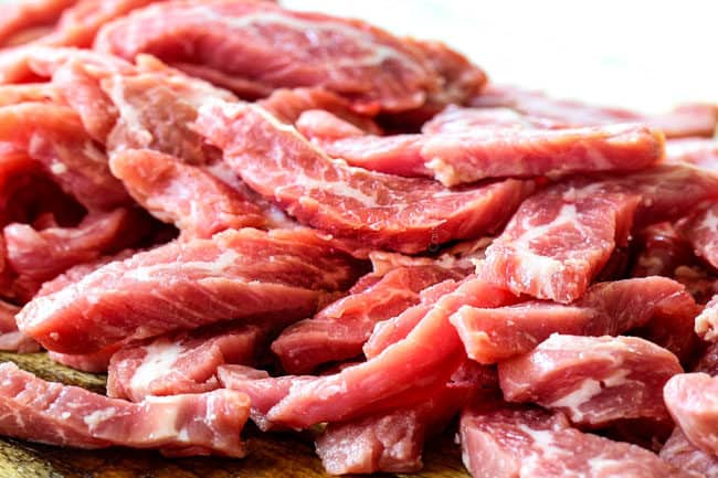 showing how to make Korean fire noodles by thinly slicing steak across the grain