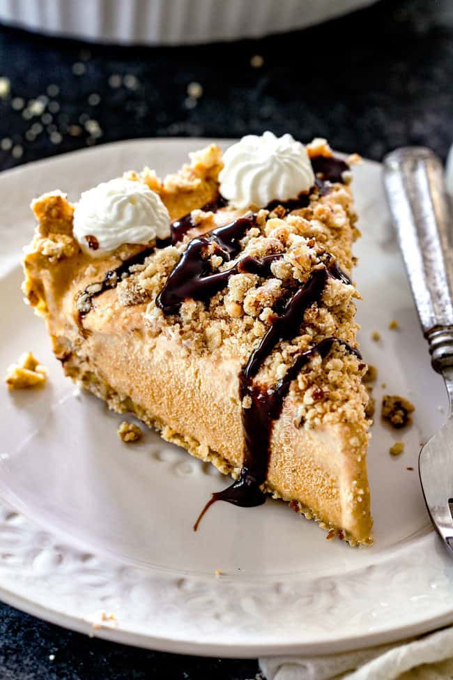 a slice of pumpkin ice cream pie with chocolate drizzle