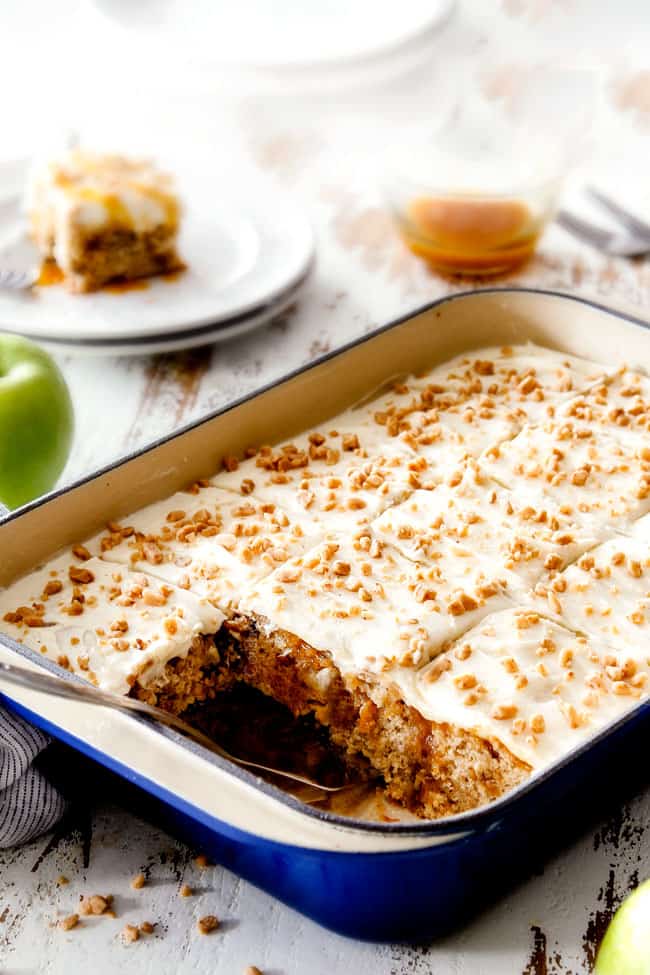 a pan of homemade poke cake with two slices missing