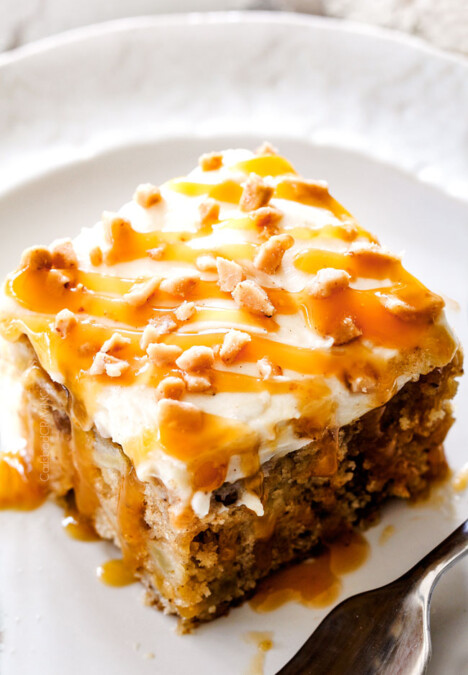 top view of a slice of poke cake drizzled with caramel