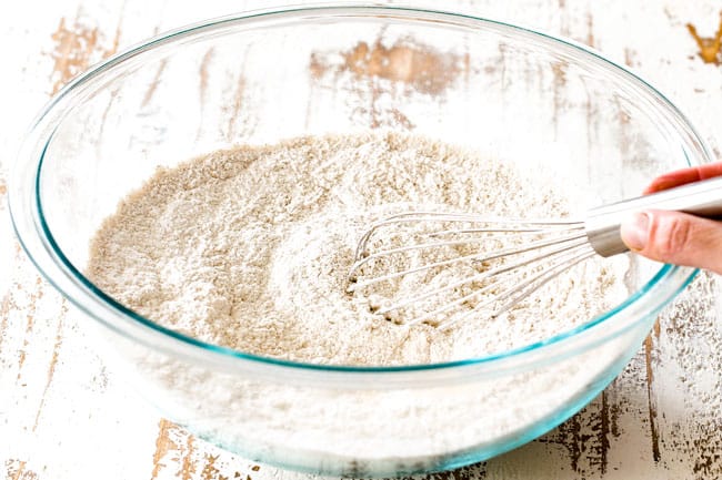 showing how to make poke cake by mixing flour, baking soda, baking powder, salt and seasonings together