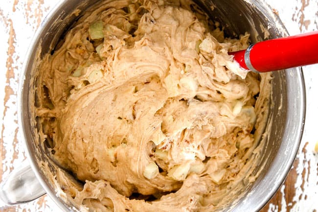 showing how to make poke cake by mixing cake batter ingredients together