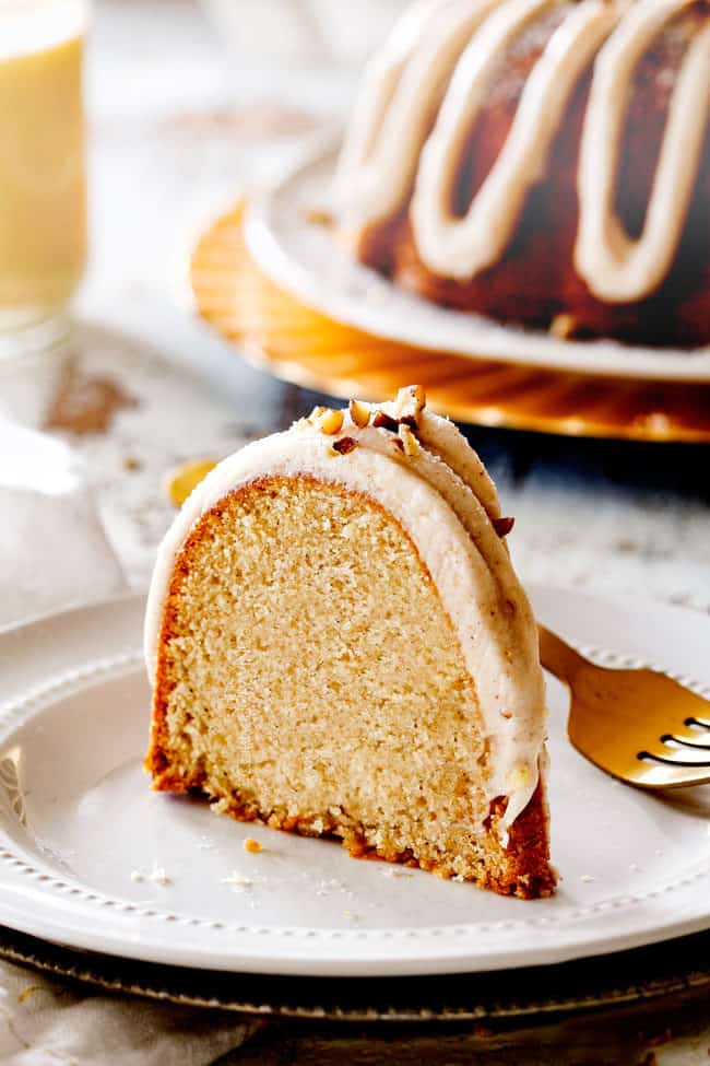 a slice of best eggnog cake standing on a white plate