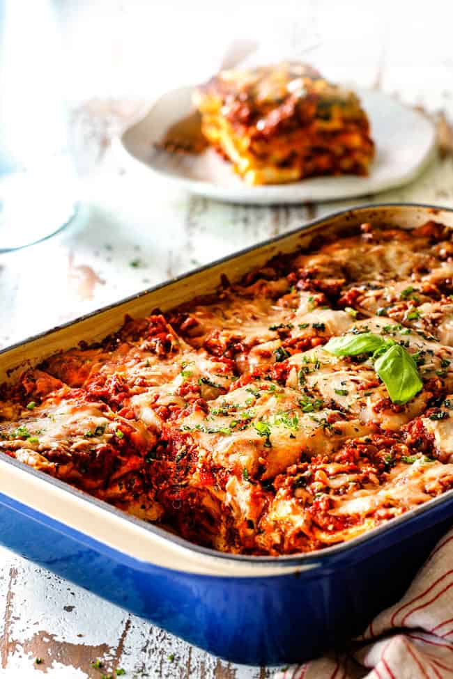 far away view of side view of homemade lasagna recipe cut into square serving slices