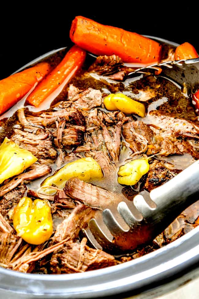 up close of tongs scooping Mississippi Pot Roast from crock pot