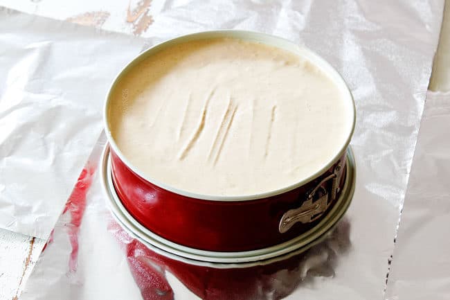 showing how to make pecan pie cheesecake by waterproofing springform pan