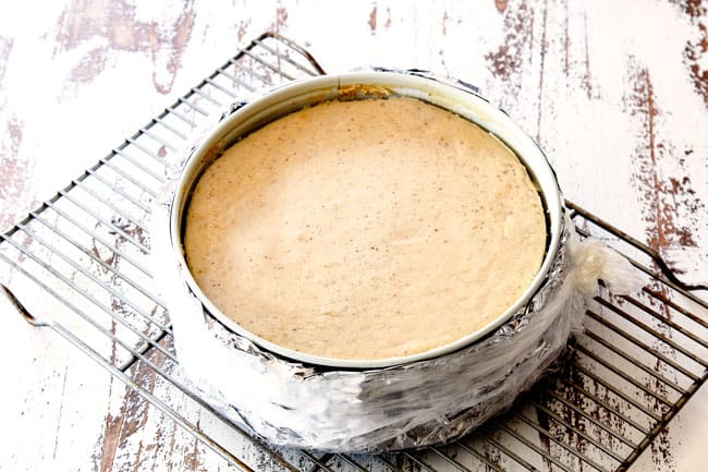 showing how to cool pecan pie cheesecake on a wire rack