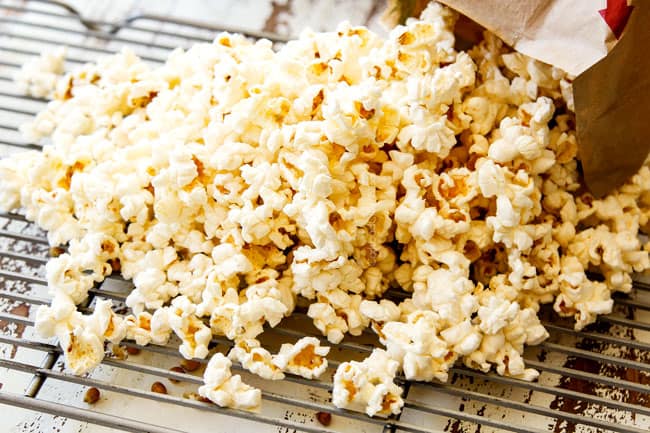 showing how to make caramel corn by separating popcorn kernels from popcorn