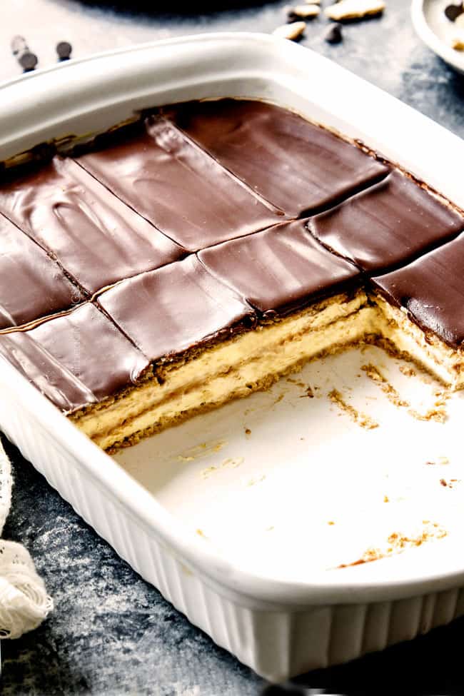 Chocolate Eclair Cake in a 9x13 pan with pieces missing