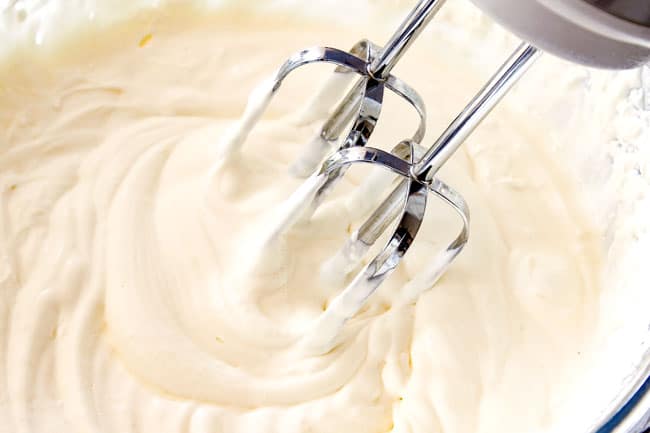 showing how to make Chocolate Eclair Cake by whipping cream